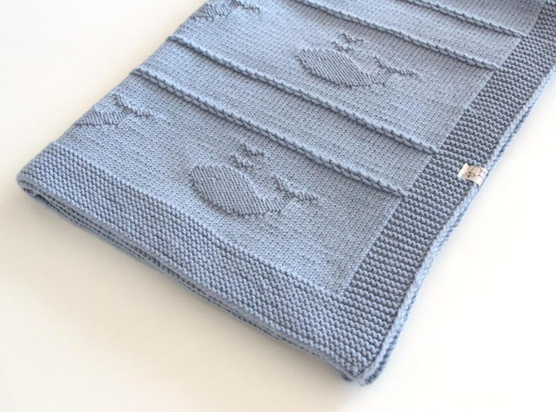 Arthur baby blanket with knitted whale motifs