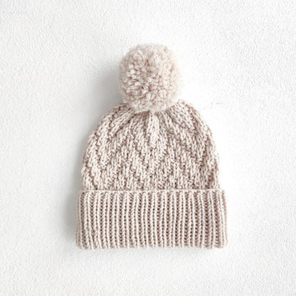Matching herringbone hat with folded brim and pompom