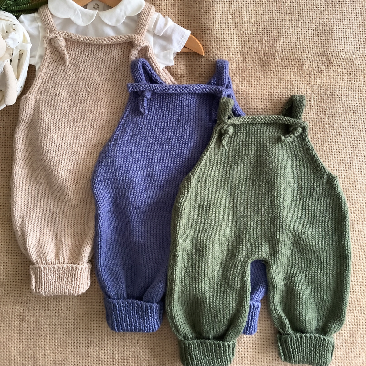 Stork baby jumpsuit knitting pattern — finished knitted outfits, view 2