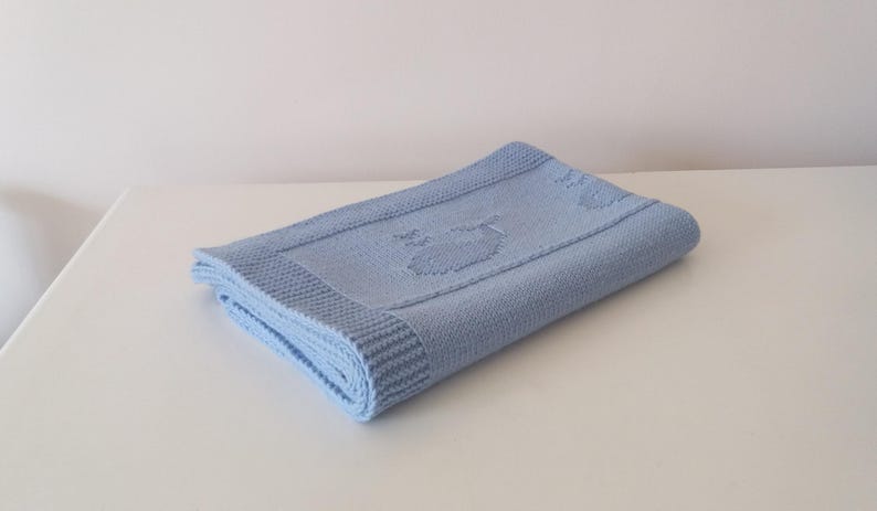 Arthur baby blanket with knitted whale motifs
